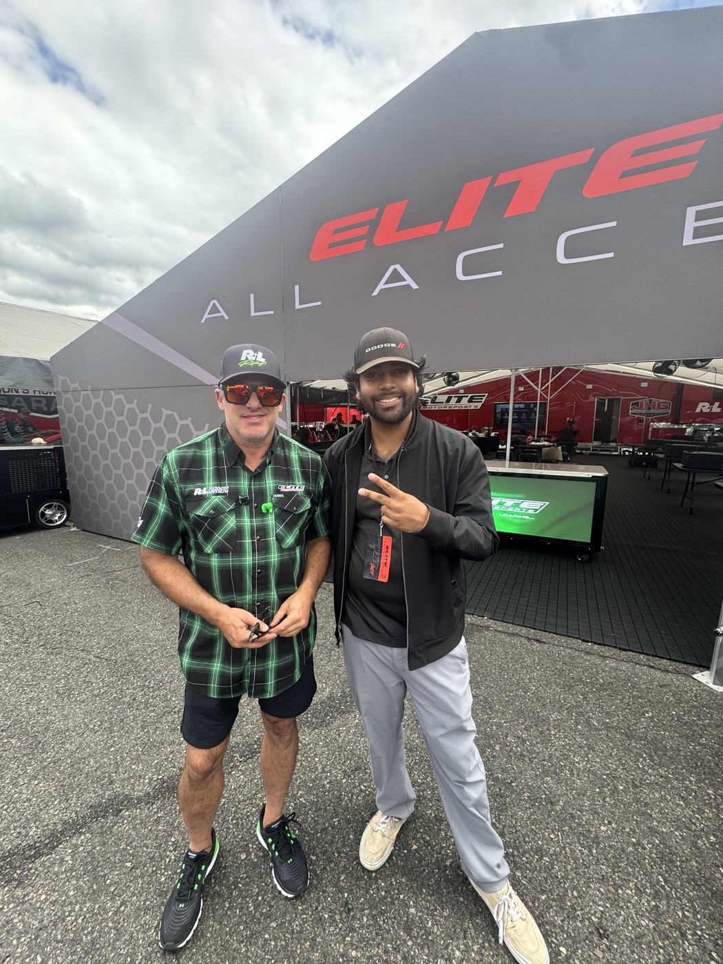 Lucky Ranasinghe, Creator and Owner of MADITECH/JOEY, standing with Tony Stewart in front of the Elite All Access tent at the 2026 NHRA event at Pacific Raceways.