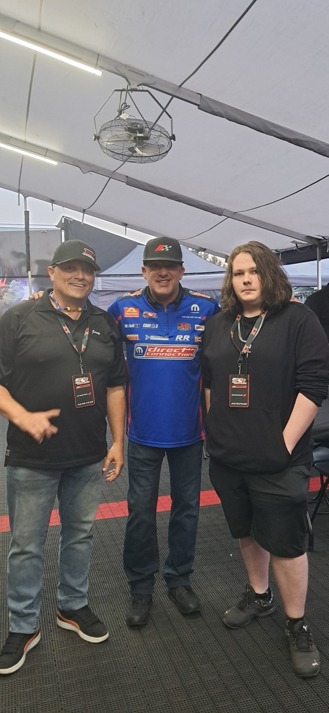 JOEY with family and Tony Stewart under the Direct Connection team tent at Pacific Raceways in 2025.