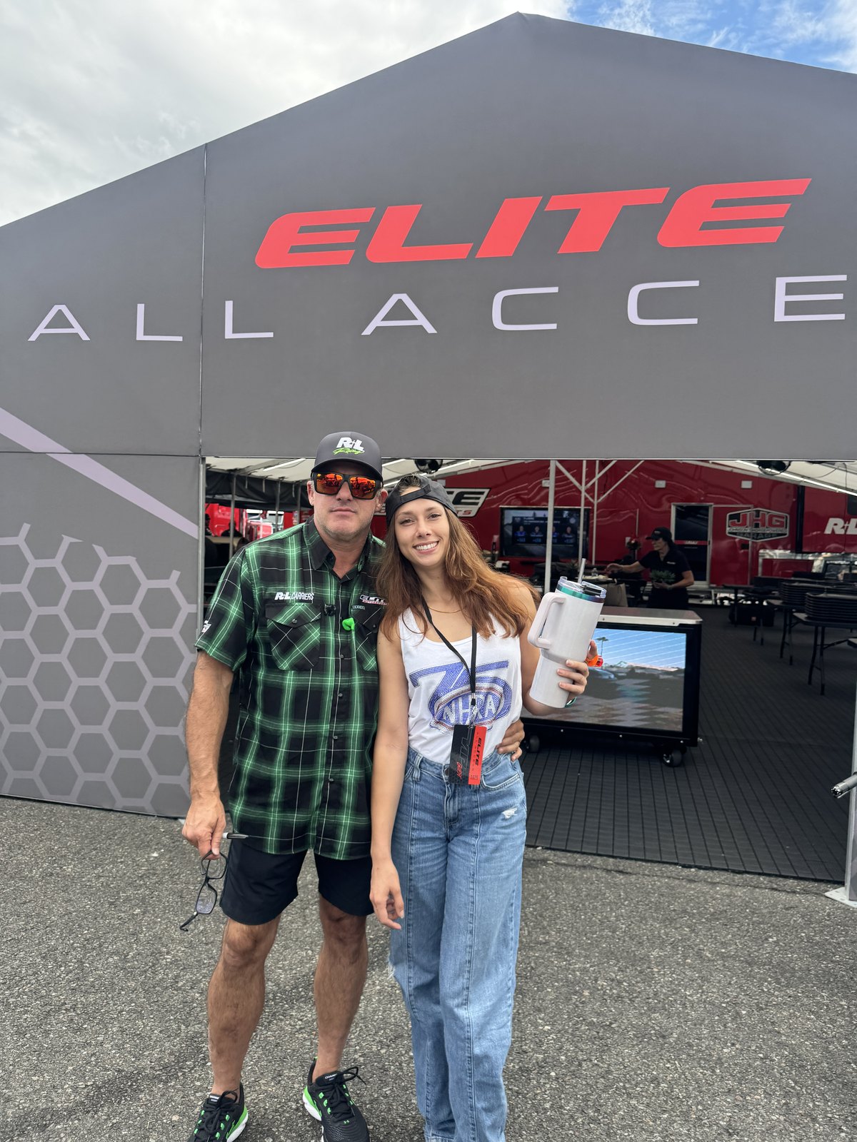 Brooke Ives, CTO of JOEY, with Tony Stewart in front of the Elite All Access tent at Pacific Raceways in 2026.