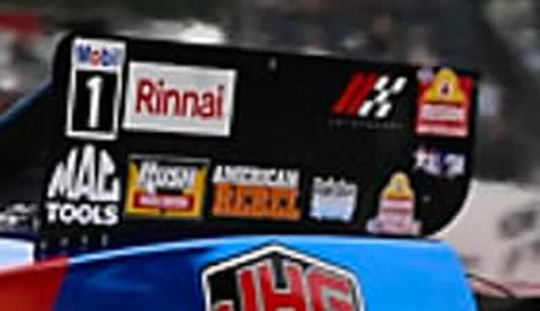 Close crop of the Rairdon decal on Hagan's rear wing side panel, from the Competition Plus photo