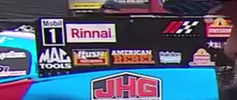 Close crop of the Rairdon decal on Hagan's Funny Car behind the FOX interview