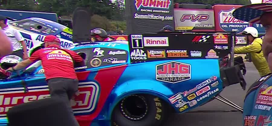 NHRA frame of Hagan's Funny Car with the crew after the win