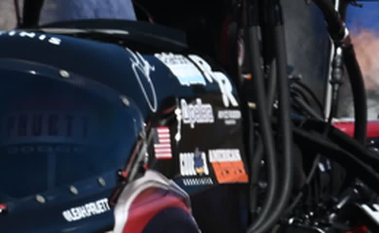 Close crop of the sponsor decals on the cowl of Leah Pruett's dragster